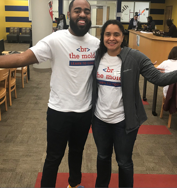 Two ADP employees wearing Break the Mold t-shirts