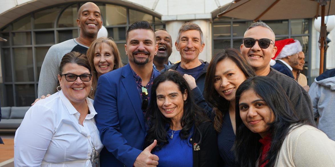 an ethnically diverse group of men and women from ADP