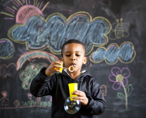 child-blowing-bubbles