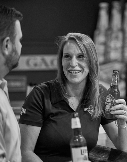 Two Reyes Holdings' Beer Division team members enjoying Reyes' beverage products.