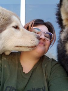 person with two dogs