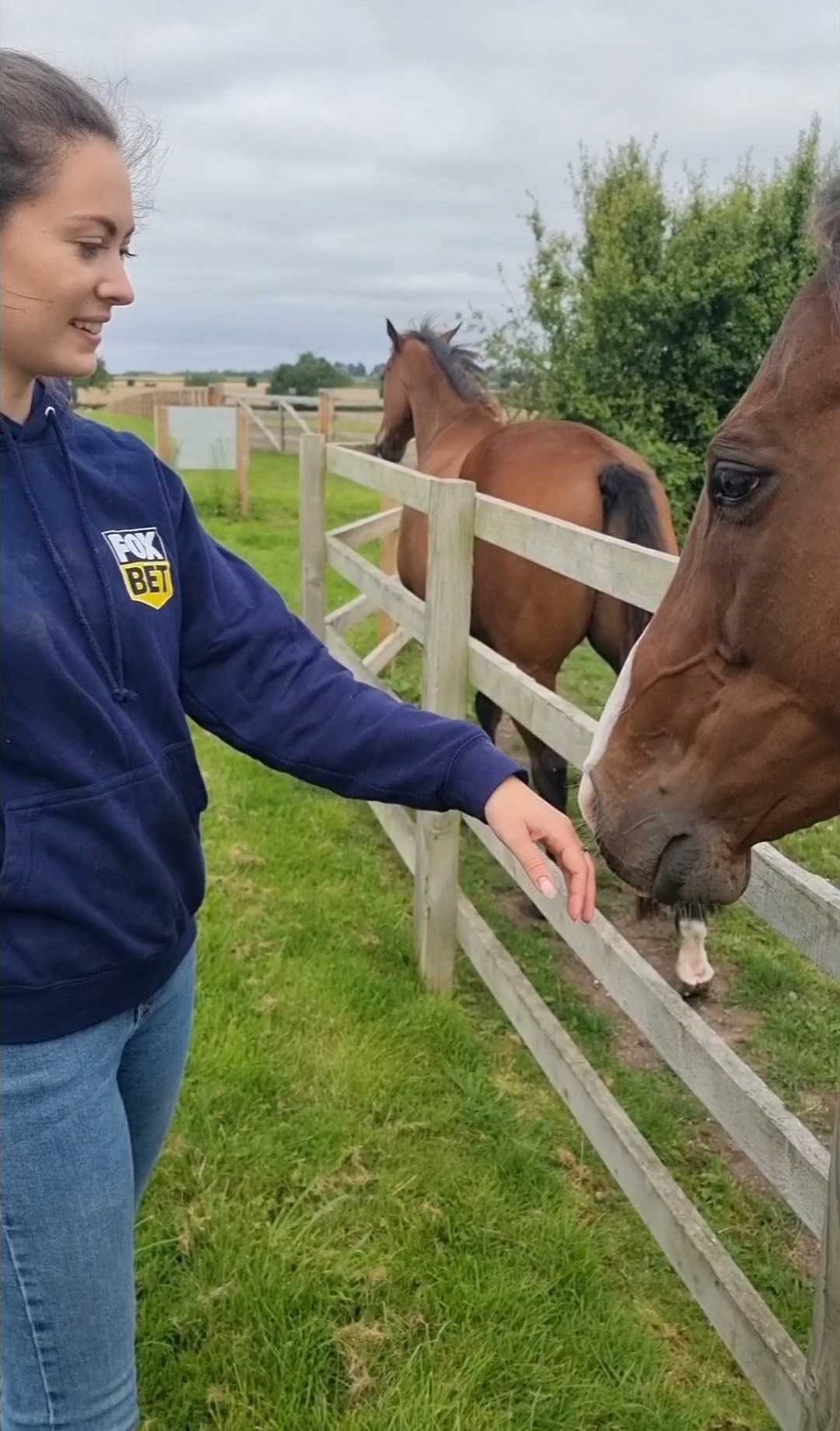 Kate Marchant Kate stroking a horse.