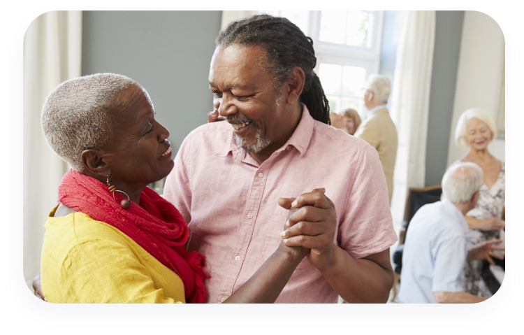 Older couple dancing to a slow song.