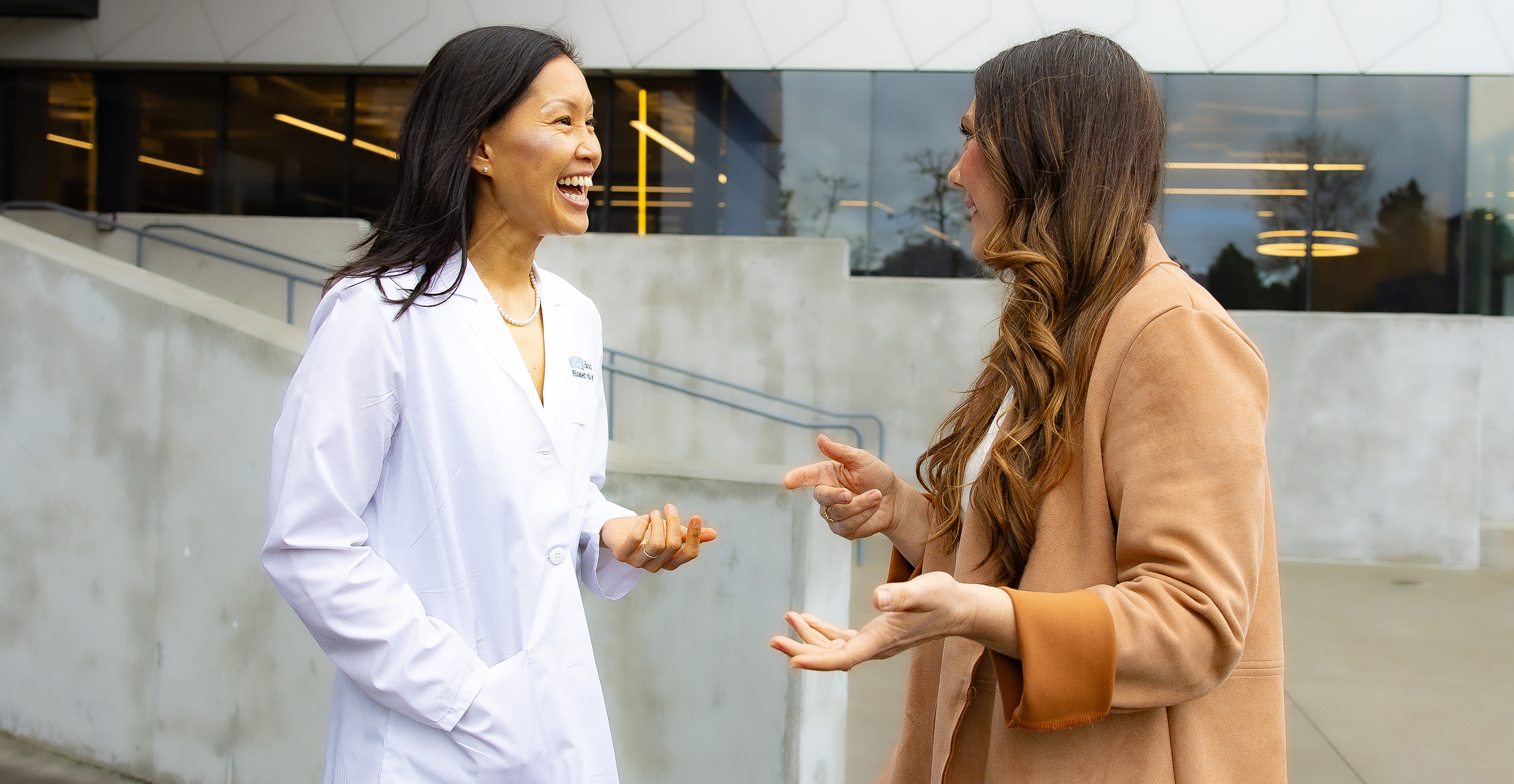 Physician and nurse smiling