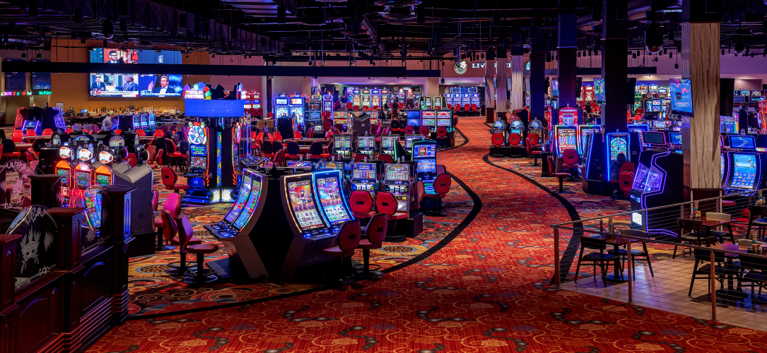 – Interior shot of Mardi Gras Casino and Resort, slot machines