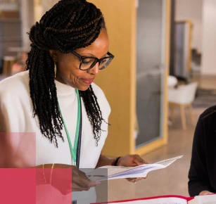 Female African American teacher looking at papers in a school setting