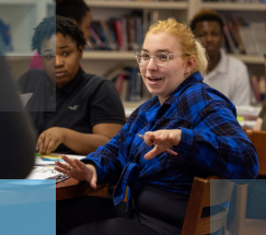 Diverse group of high school students at desks in a classroom setting