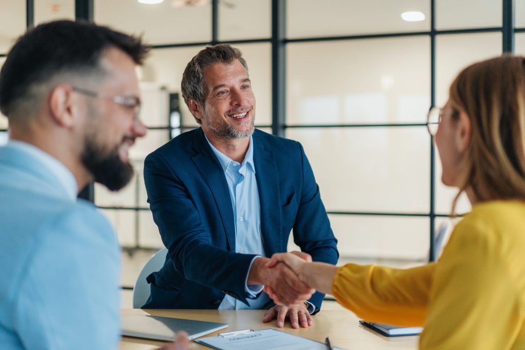 Business people shaking hands in the office. 