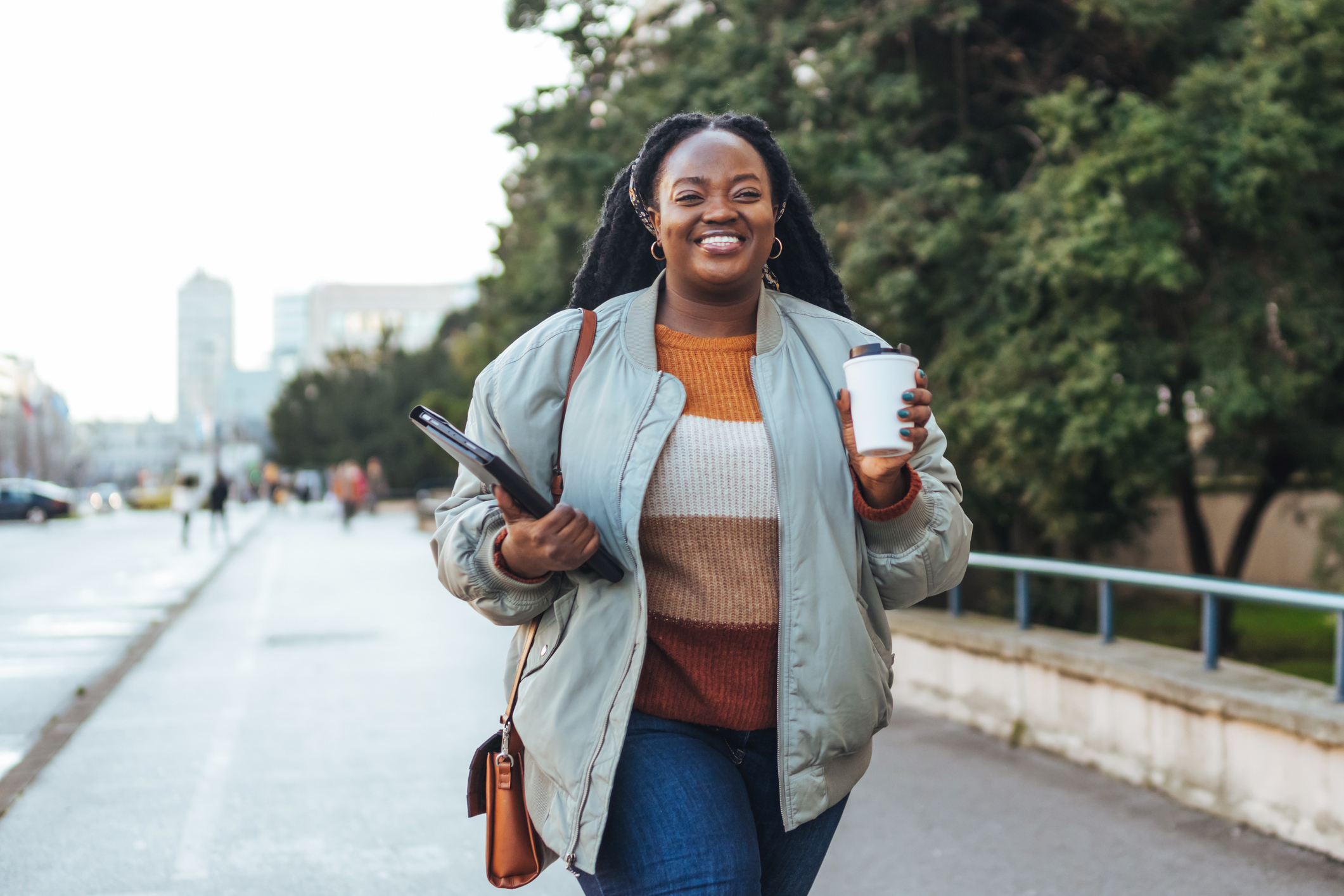 Professional walking to work, symbolizing Remitly’s product team driving progress and creating solutions that move families forward.