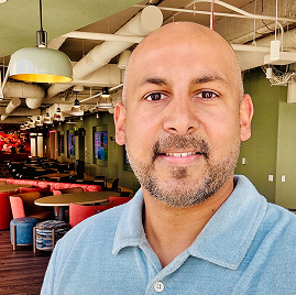 Headshot of a Remitly team member talking about how they embody the company’s cultural values.