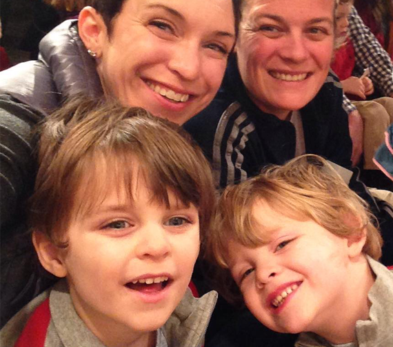 Blair, an Instructional Designer with Allstate, seated at an event with another woman and two children