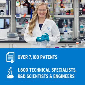 woman in white coat in lab