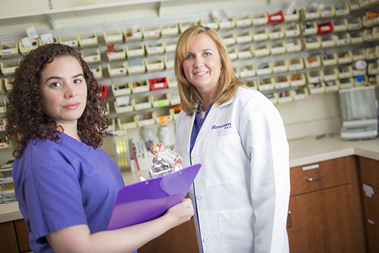Nurse getting medicine from medical transcript