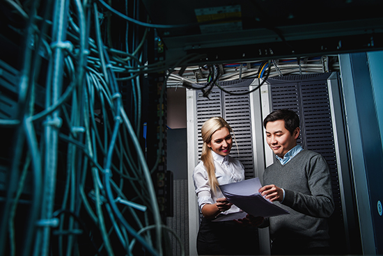 A female and male network admins are discussing about network