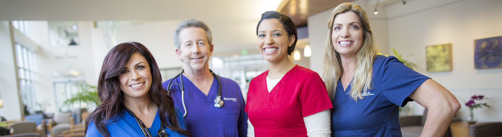 Doctor and nurses smiling at camera