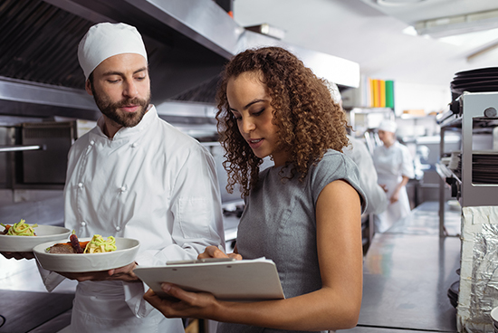 Quality analyst checking the quality of the food with checklist