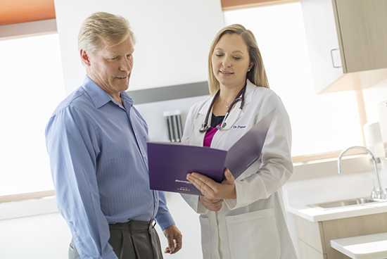 Doctor explaining patient with his files