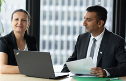 Two employees at workstation