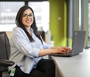 Woman sitting at laptop