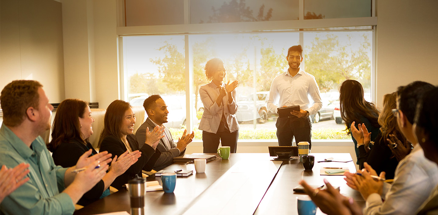 HGV team members applauding another team member