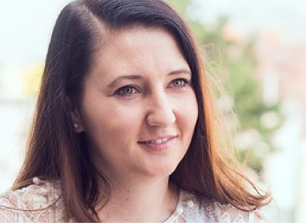 young ADP associate holding a mug