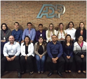 group of ADP associates seated and standing in two rows