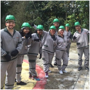 group of ADP associates in gray uniforms and green hardhats