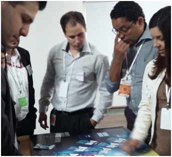 small team of ADP associates looking at items on a table