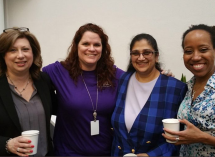 small group of women ADP associates smiling for a picture