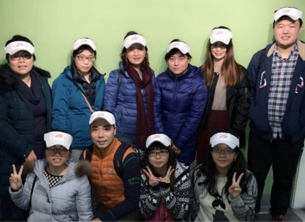group of ADP associates wearing heavy coats and white sun visors