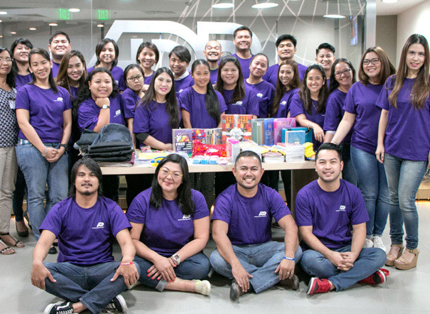 group of ADP associates in purple T-shirts